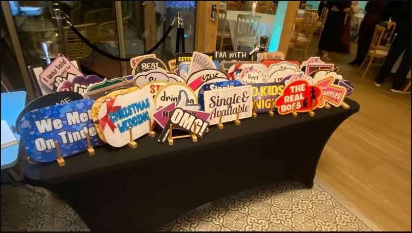 Limelite prop table filled with colourful signs ready for guests
