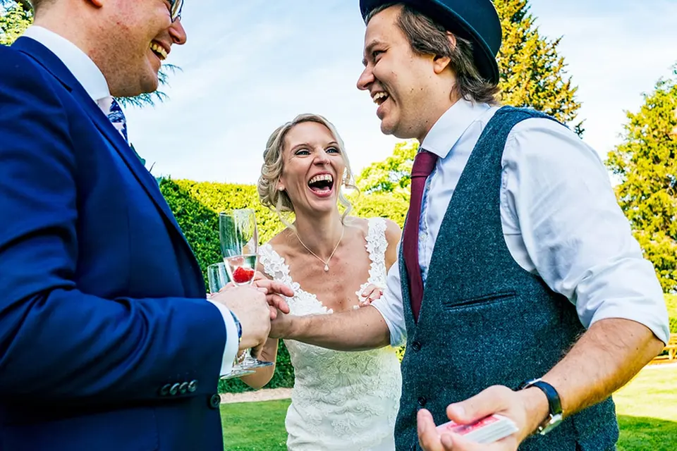 Darren Campbell performing close-up magic for a newly married couple