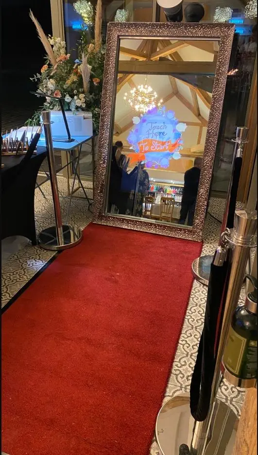 Limelite bronze-framed Magic Mirror ready for guests on a red carpet